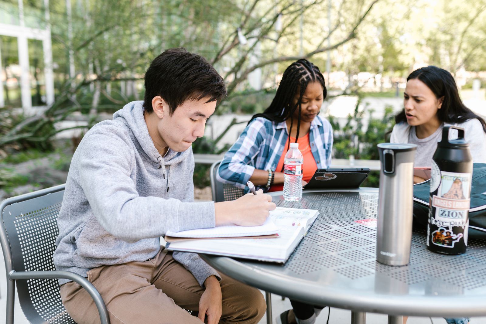 Students working together outdoors on a college campus